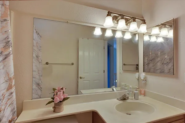 a bathroom with a sink and a mirror