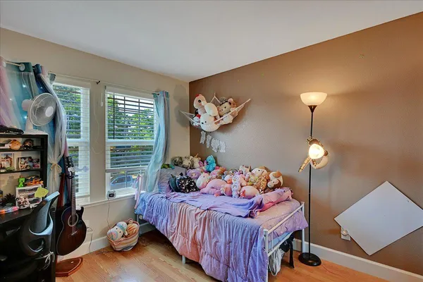 a bedroom with bed and a window