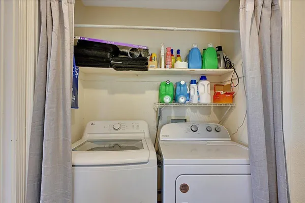 a utility room with dryer and washer