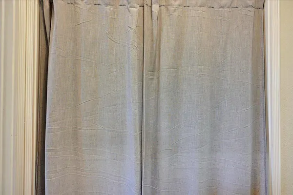 a bathroom with a shower curtain