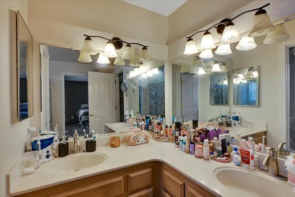 a bathroom with a sink double vanity and a mirror