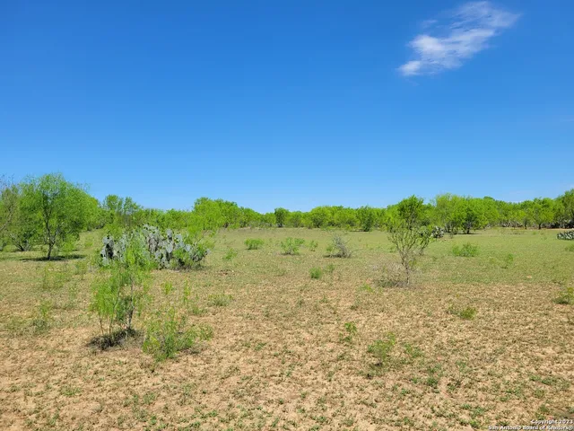 a view of lake with green space