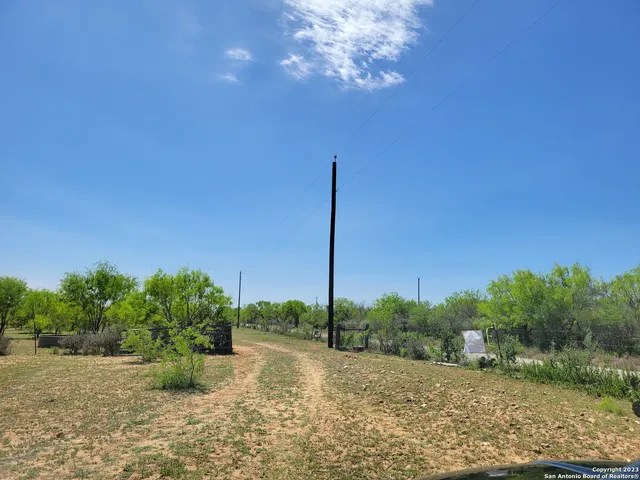 a view of a yard with an ocean view