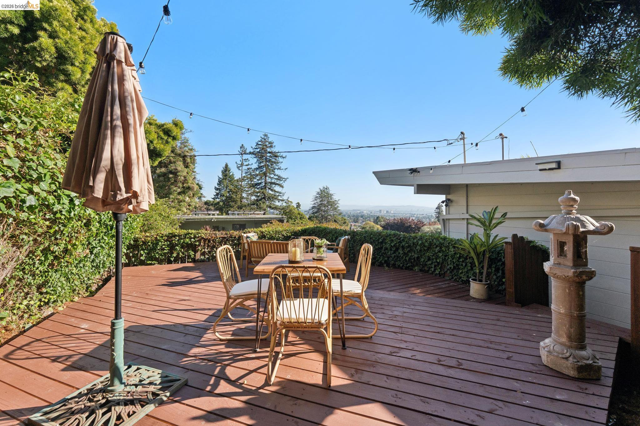 2301 Oak Street Berkeley, CA 94708 - Photo 45 of 61 Expansive wood-finish deck surrounded by mature greenery