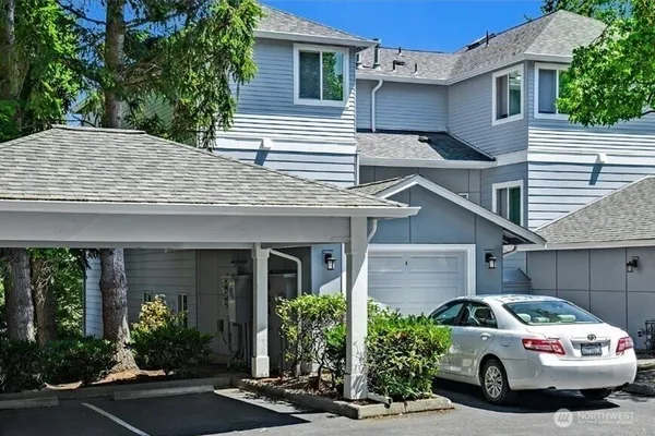 a view of a car parked in front of a house