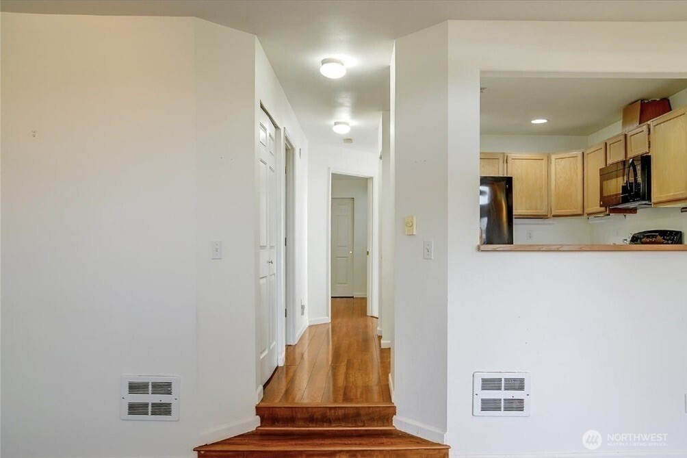 8515 244th Street Southwest, Unit A2 Edmonds, WA 98026 - Photo 11 of 22 a view of kitchen with furniture and wooden floor