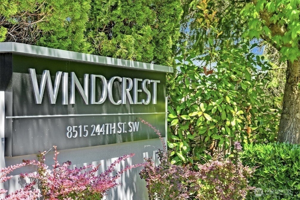 8515 244th Street Southwest, Unit A2 Edmonds, WA 98026 - Photo 2 of 22 a sign on the side of the road