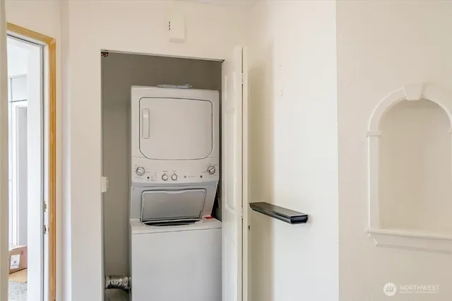 a view of a bedroom with wooden floor and closet