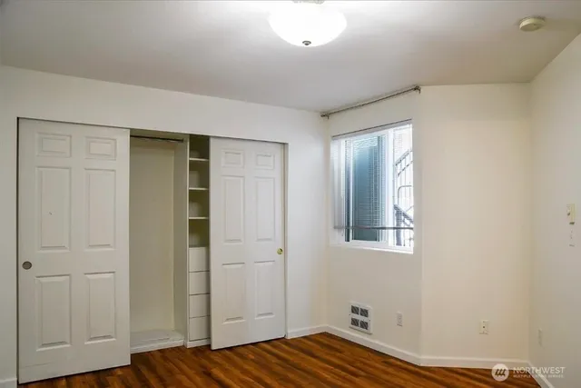 a view of room with wooden floor