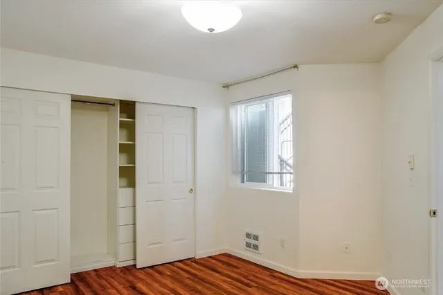 a room with a bed and furniture