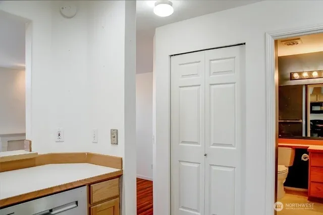 a bathroom with a shower and a glass door
