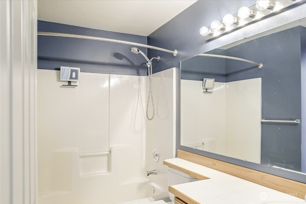 8515 244th Street Southwest, Unit A2 Edmonds, WA 98026 - Photo 10 of 22 a bathroom with a shower and a glass door