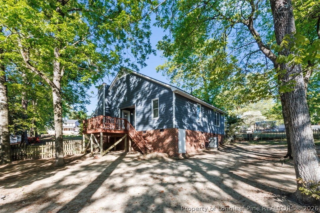 1205 Crossbend Court Fayetteville, NC 28314 - Photo 29 of 37 a view of a wooden deck with a tree