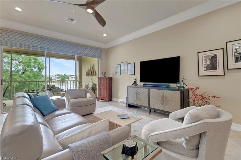 3620 Lansing Loop, Unit 202 Estero, FL 33928 - Photo 13 of 40 a living room with furniture and a flat screen tv