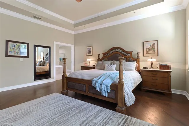 a bedroom with a bed and a night stand
