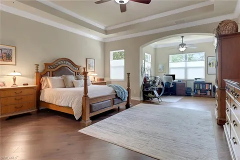 a bedroom with bed and window
