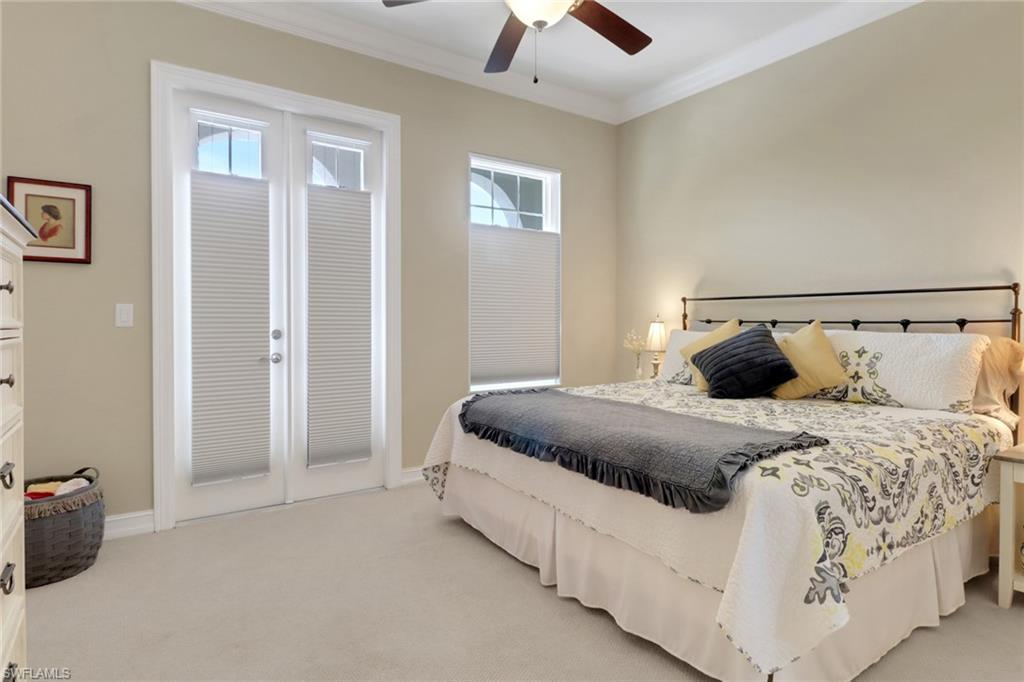 3620 Lansing Loop, Unit 202 Estero, FL 33928 - Photo 22 of 40 a bedroom with bed and window