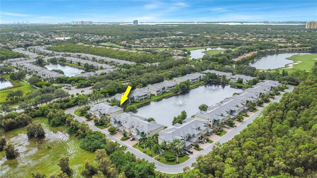 3620 Lansing Loop, Unit 202 Estero, FL 33928 - Photo 30 of 40 an aerial view of a city with mountains