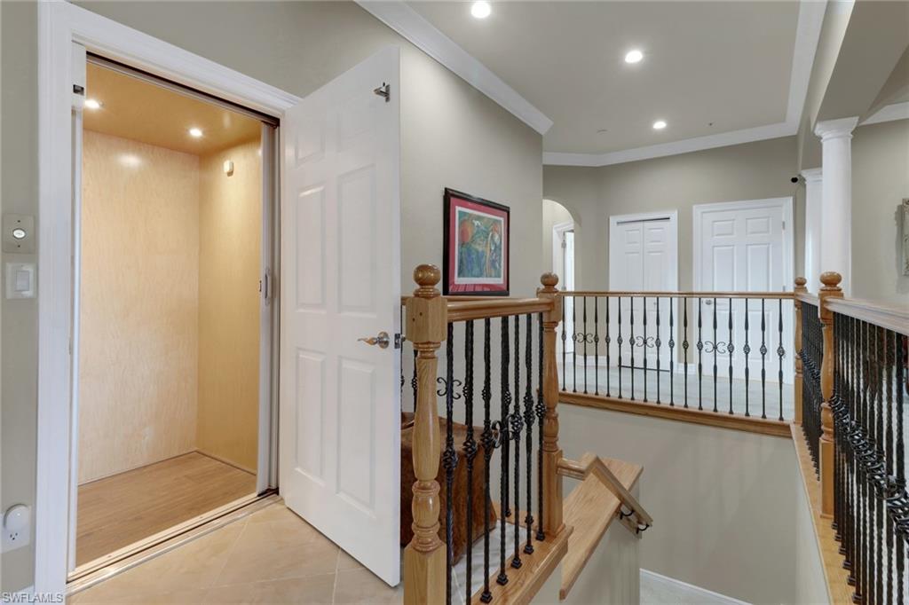 3620 Lansing Loop, Unit 202 Estero, FL 33928 - Photo 3 of 40 a view of a hallway with windows and stairs