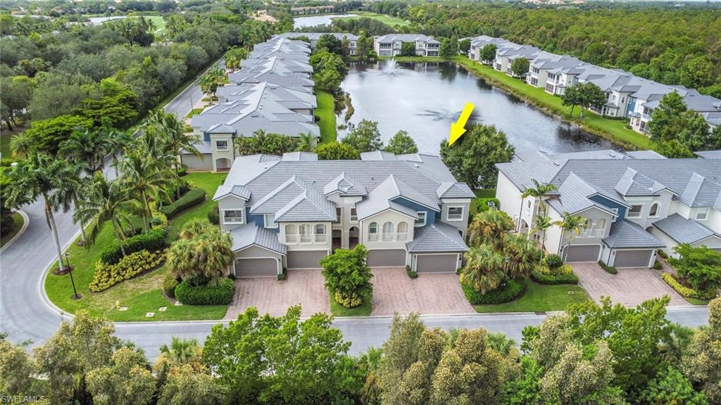 3620 Lansing Loop, Unit 202 Estero, FL 33928 - Photo 33 of 40 an aerial view of house with yard swimming pool and outdoor seating