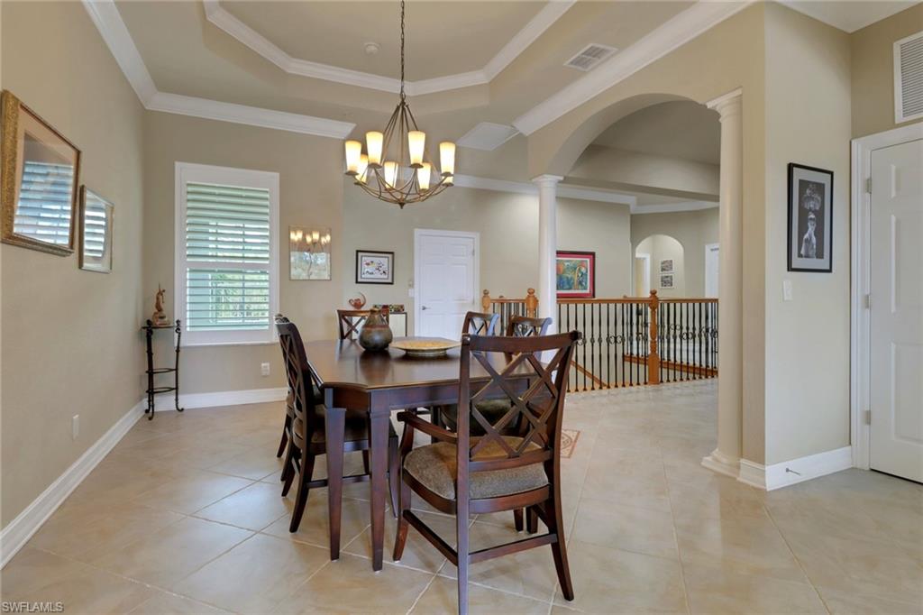 3620 Lansing Loop, Unit 202 Estero, FL 33928 - Photo 6 of 40 a view of a dining room with furniture and chandelier
