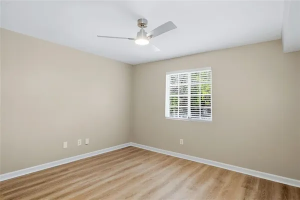 a spacious bedroom with a bed and a couch