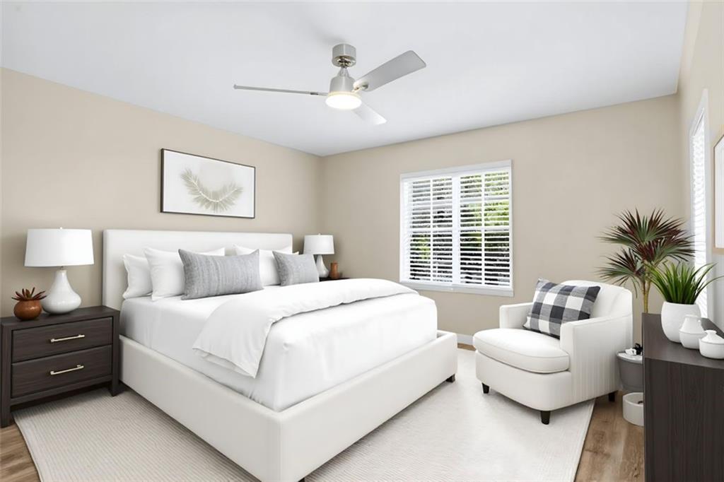 210 Sampson Street Northeast, Unit 5 Atlanta, GA 30312 - Photo 10 of 21 a spacious bedroom with a bed and a couch