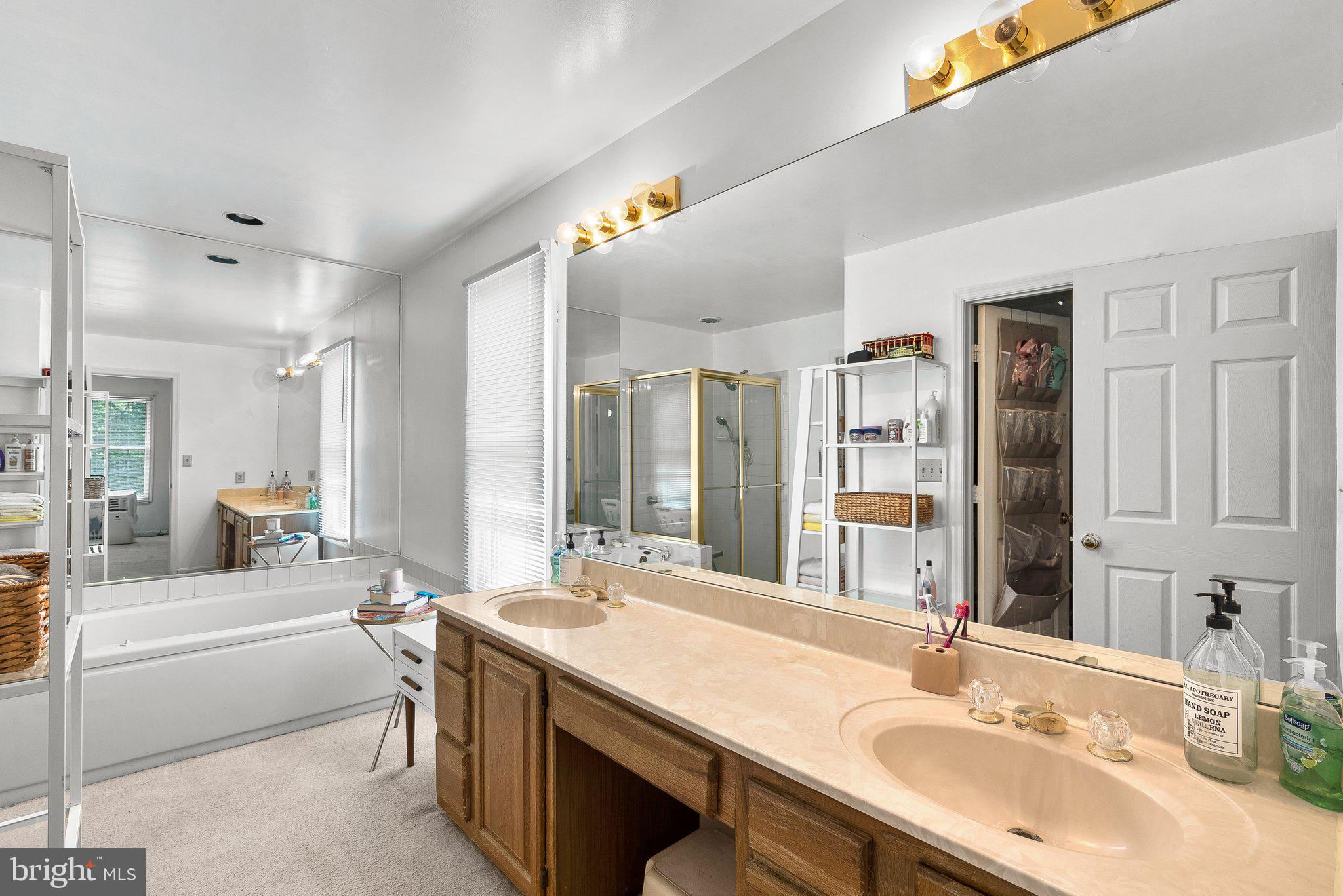 1400 Baytree Terrace Bowie, MD 20721 - Photo 22 of 39 a bathroom with a granite countertop sink and a large mirror