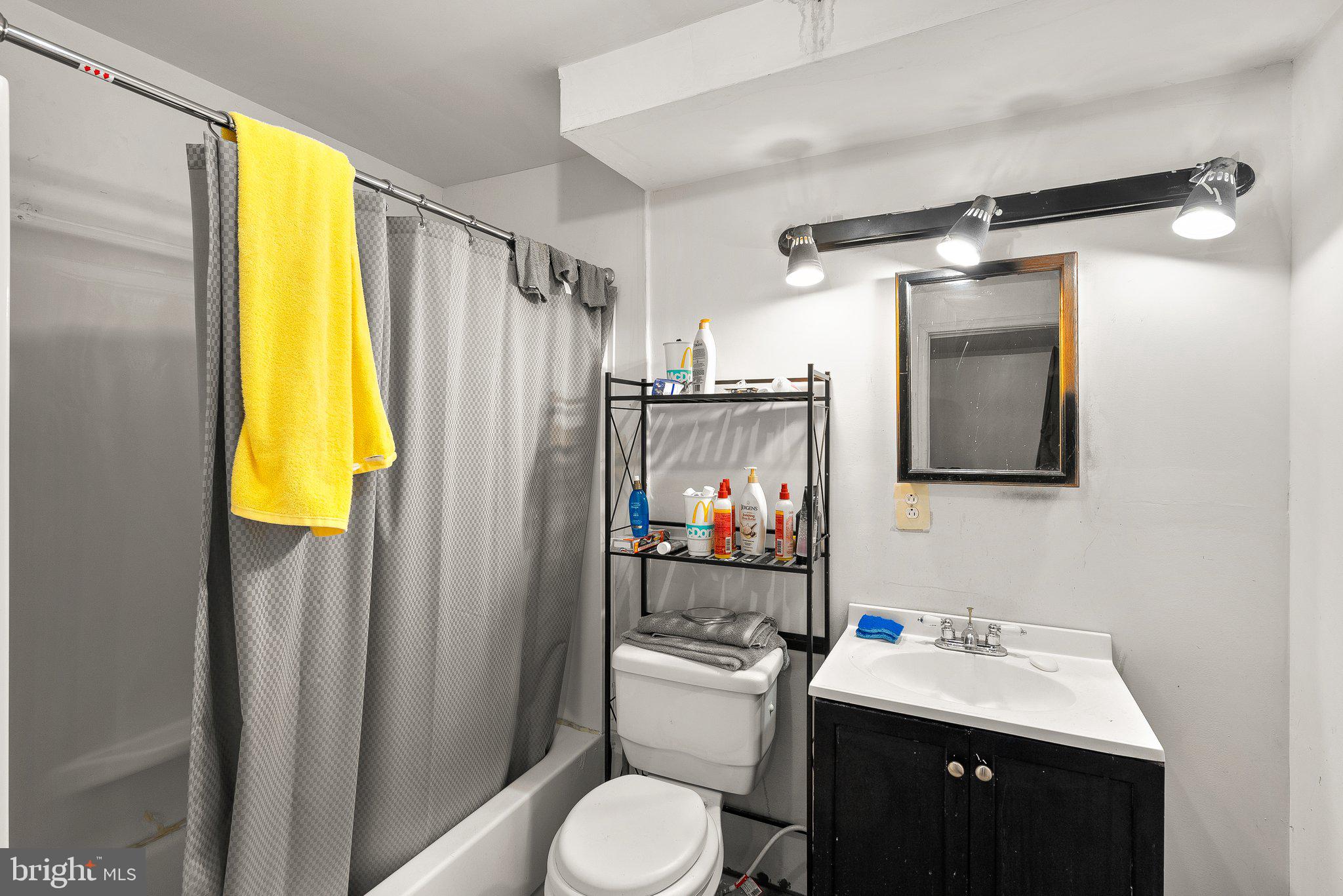 1400 Baytree Terrace Bowie, MD 20721 - Photo 27 of 39 a bathroom with a sink vanity mirror and toilet