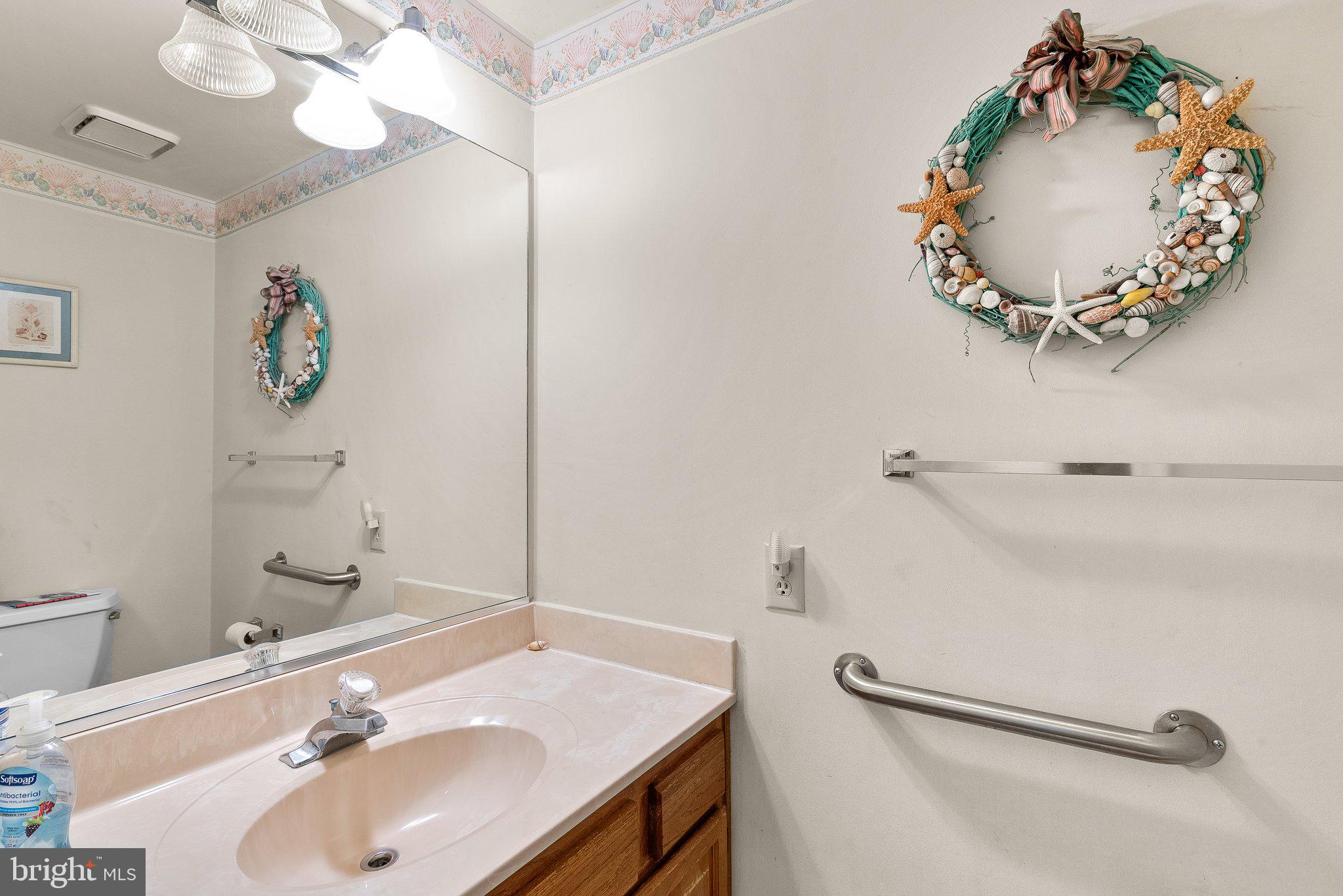 1400 Baytree Terrace Bowie, MD 20721 - Photo 29 of 39 a bathroom with a sink and mirror