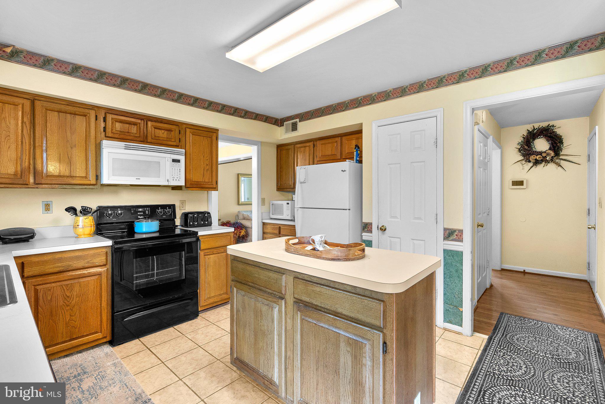 1400 Baytree Terrace Bowie, MD 20721 - Photo 7 of 39 a kitchen with a sink stove and cabinets