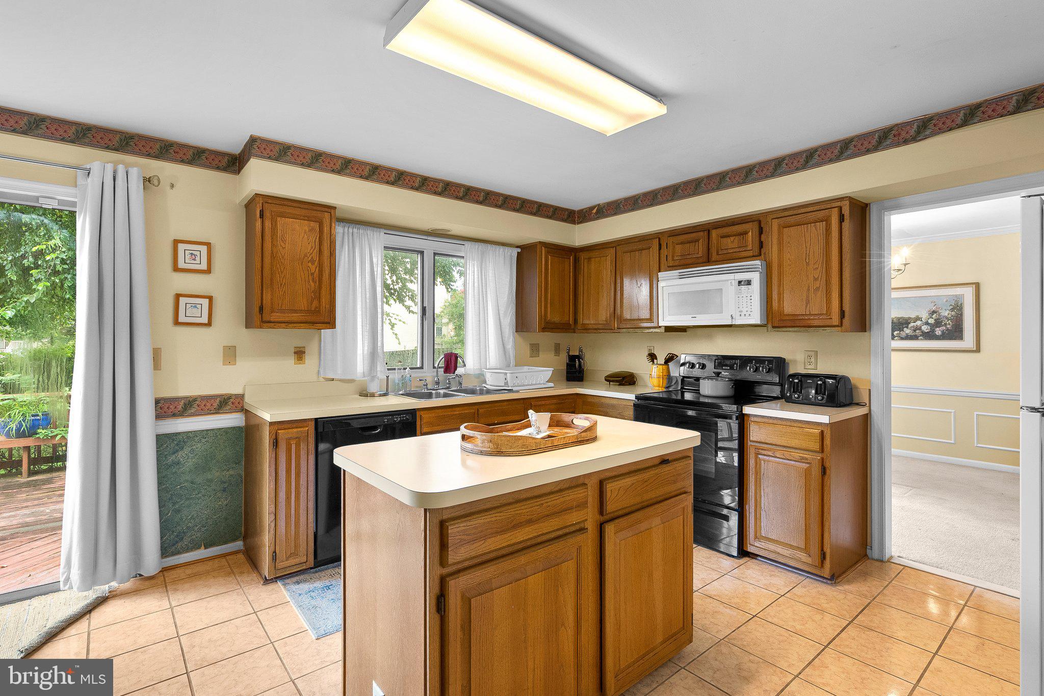 1400 Baytree Terrace Bowie, MD 20721 - Photo 8 of 39 a kitchen with a stove sink and cabinets