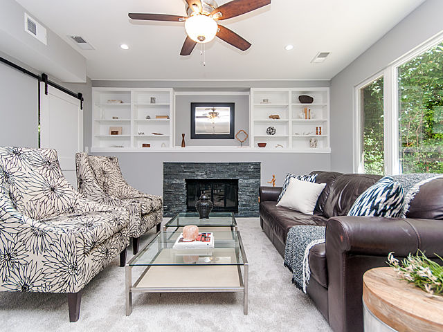243 Longcommon Road Riverside, IL 60546 - Photo 12 of 25 a living room with furniture or couch and a fireplace