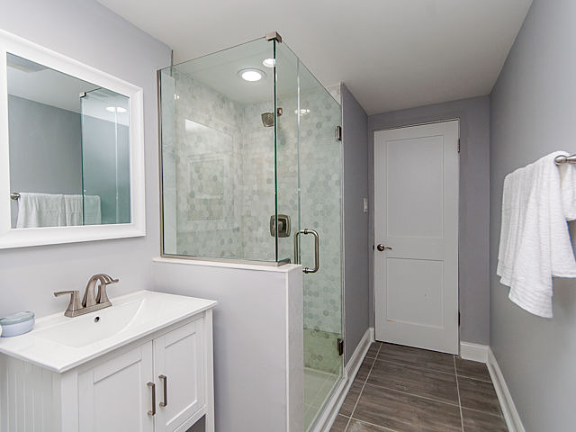 243 Longcommon Road Riverside, IL 60546 - Photo 14 of 25 a bathroom with a sink and mirror