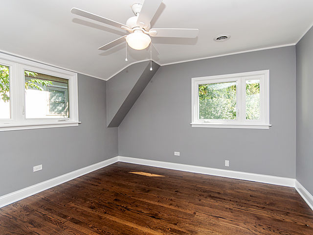 243 Longcommon Road Riverside, IL 60546 - Photo 19 of 25 a view of a room with wooden floor and window