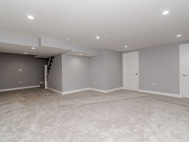 243 Longcommon Road Riverside, IL 60546 - Photo 20 of 25 an empty room with a empty space and a hallway