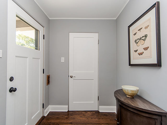 243 Longcommon Road Riverside, IL 60546 - Photo 2 of 25 a view of a hallway with wooden floor and a bathroom