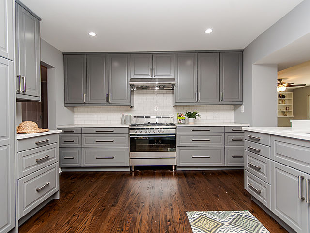 243 Longcommon Road Riverside, IL 60546 - Photo 5 of 25 a kitchen with granite countertop a stove and cabinets