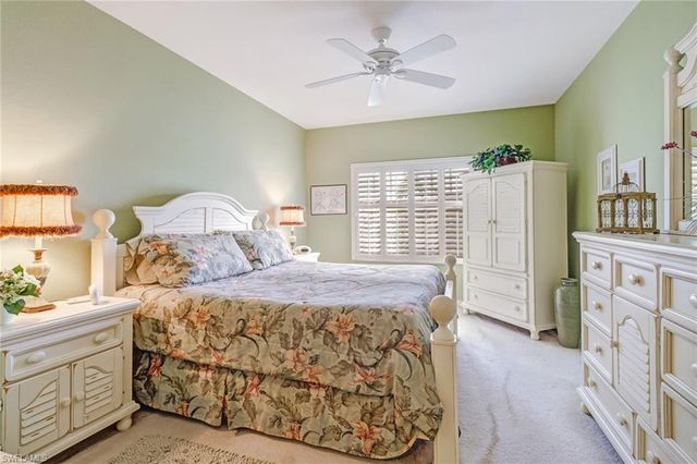 a bedroom with a bed dresser and a window