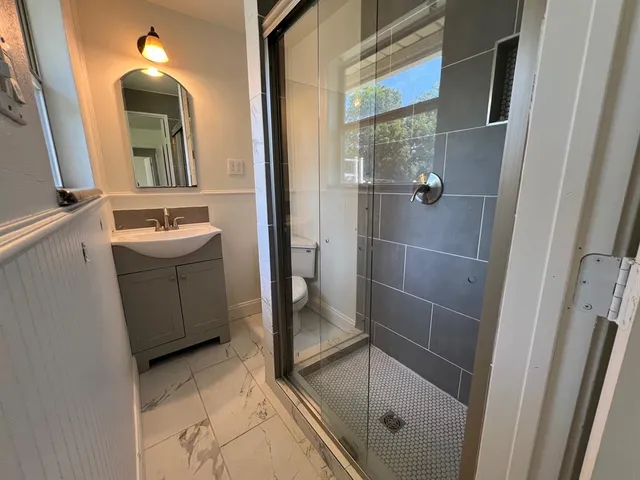 a bathroom with a sink and mirror
