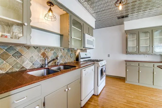 a kitchen with a sink and cabinets