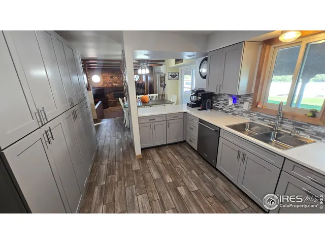 a upper view of a kitchen with a sink and refrigerator