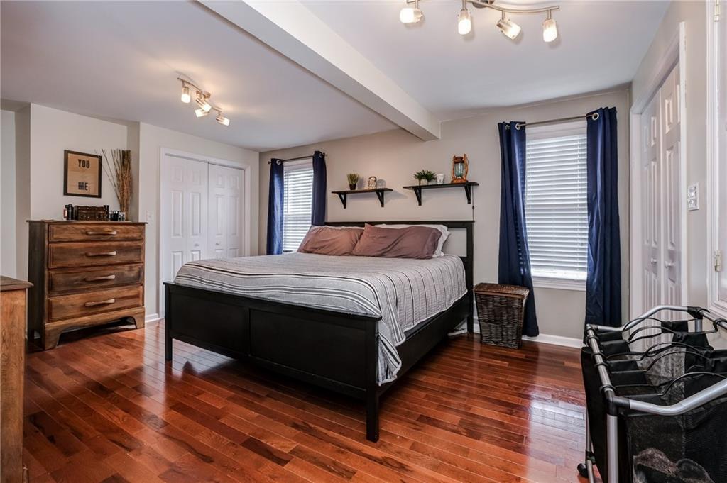 282 Meridian Road Butler, PA 16001 - Photo 14 of 25 a bedroom with a bed and wooden floor