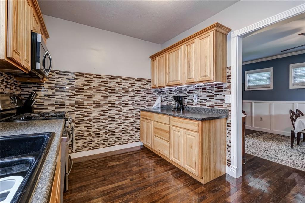 282 Meridian Road Butler, PA 16001 - Photo 8 of 25 a kitchen with stainless steel appliances a stove a sink and a refrigerator