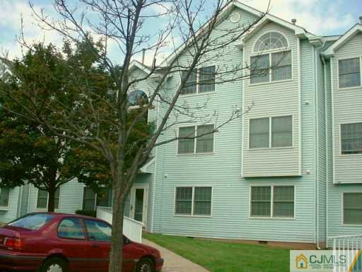 613 Edpas Road New Brunswick, NJ 08901 - Photo 2 of 7 a front view of a house with a garden
