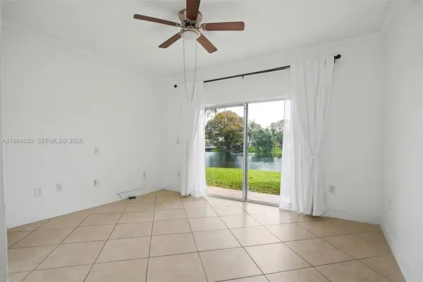 a view of an empty room with a window