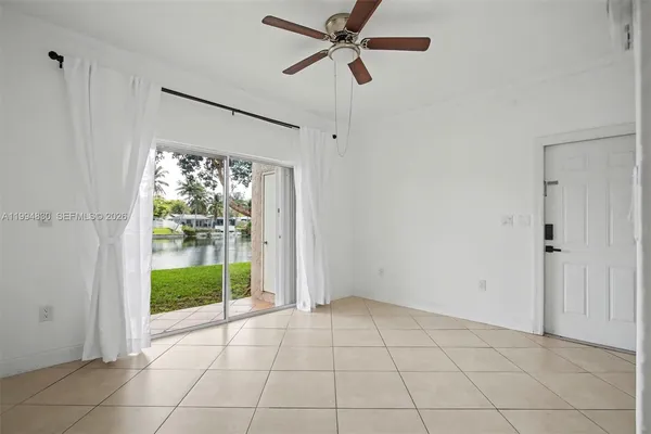 a view of an entryway with a ceiling fan