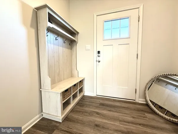 a kitchen with a refrigerator a stove a sink dishwasher and a microwave with wooden floor