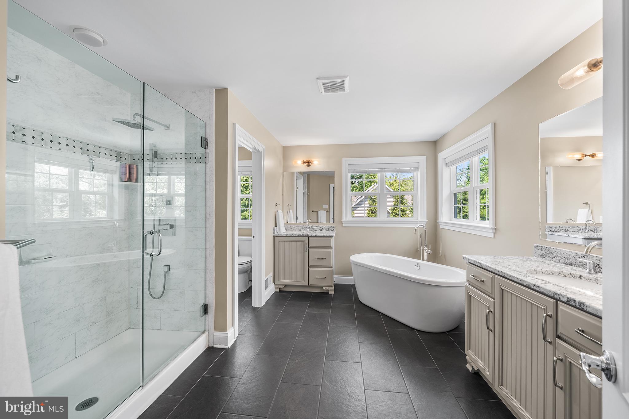 515 Old Eagle School Road Wayne, PA 19087 - Photo 21 of 40 a bathroom with a tub sink shower and mirror
