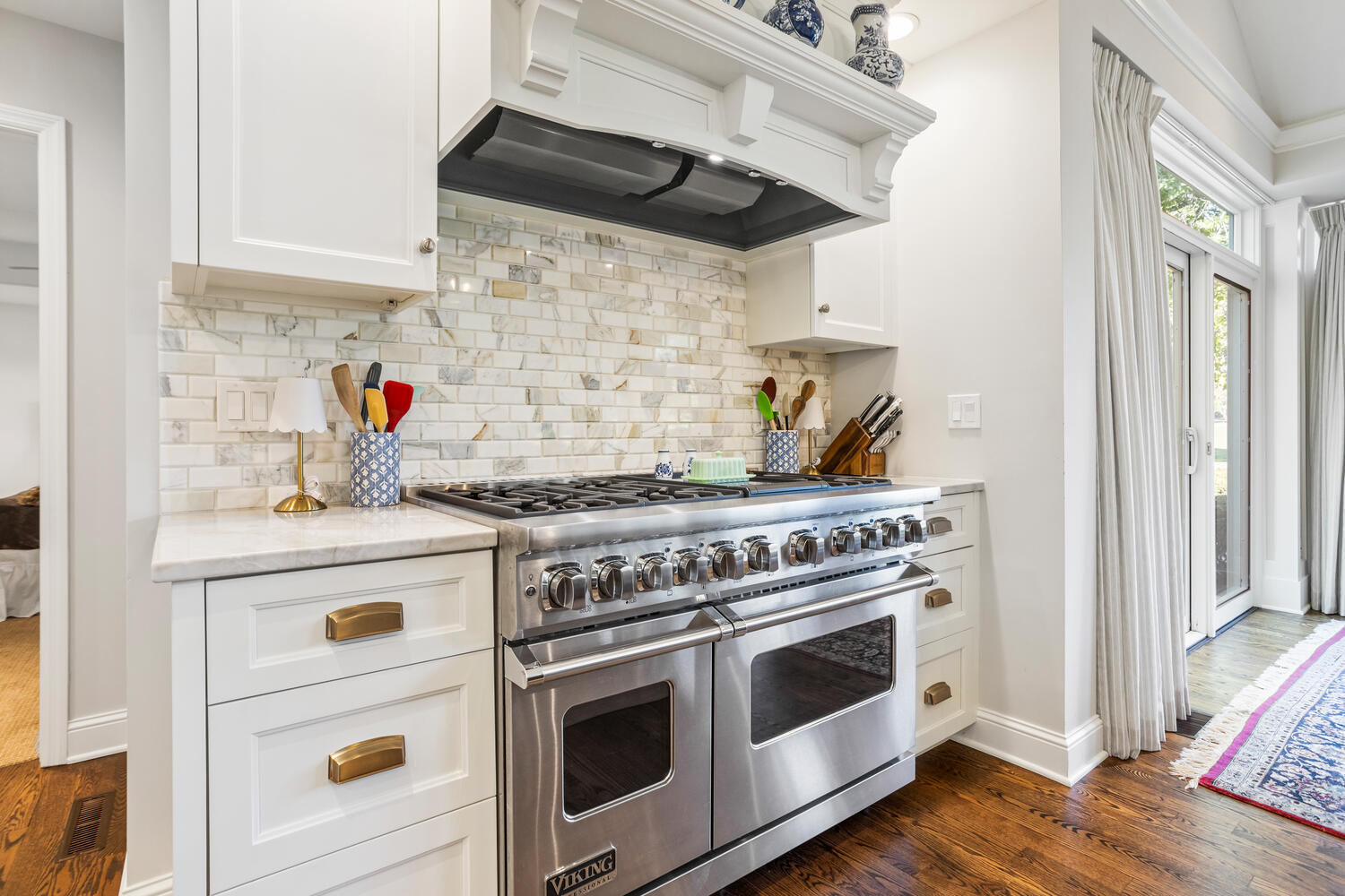 7 Greencroft Drive Champaign, IL 61821 - Photo 15 of 44 a kitchen with stainless steel appliances granite countertop a stove and a wooden floor